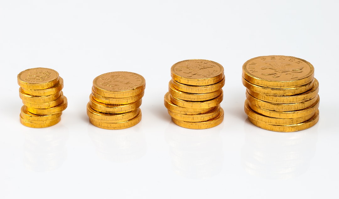 a stack of gold coins sitting next to each other